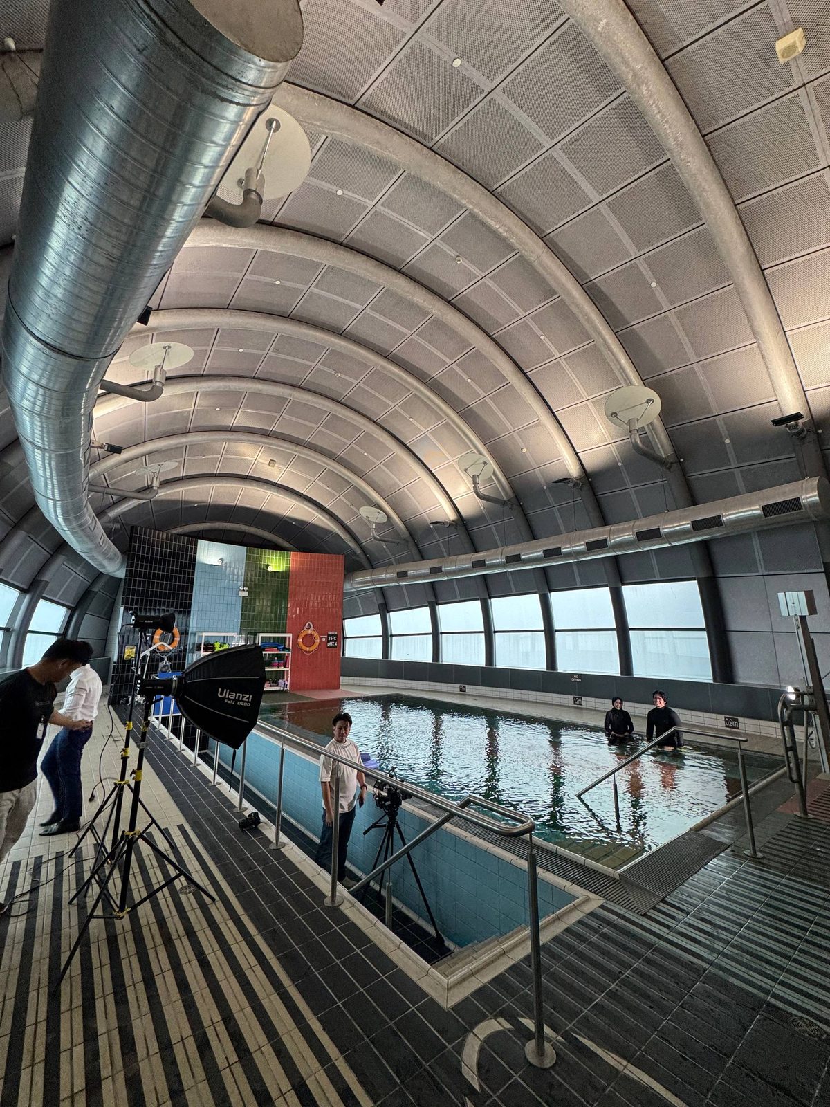 A Creo crew sets up lights and cameras beside the hydrotherapy pool at Prince Court Medical Centre, Kuala Lumpur